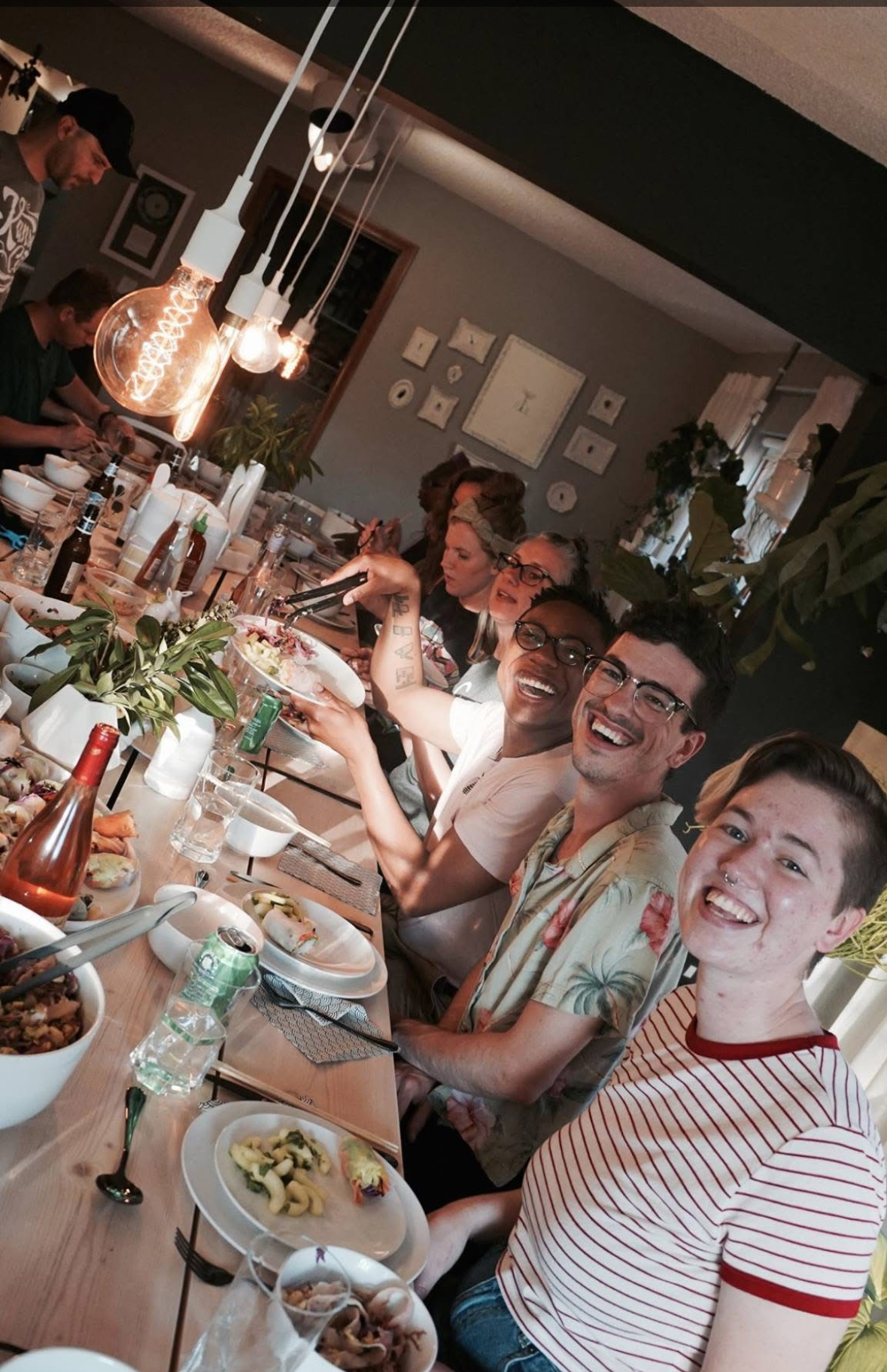 Inclusive community event where strangers become friends over a shared meal at Open Table.